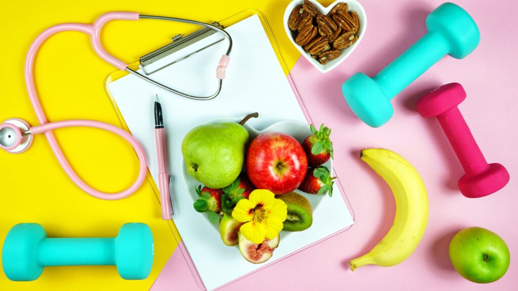 fruit, nuts, stethoscope, weights spread on table
